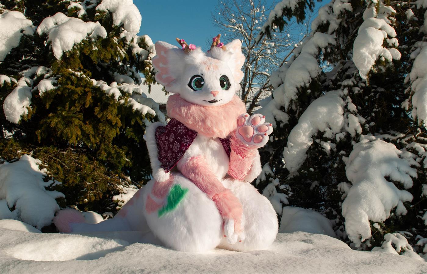 White and pink custom fursuit in the snow